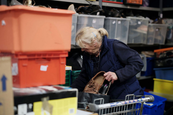 Image of Hospice volunteer sorting clothes