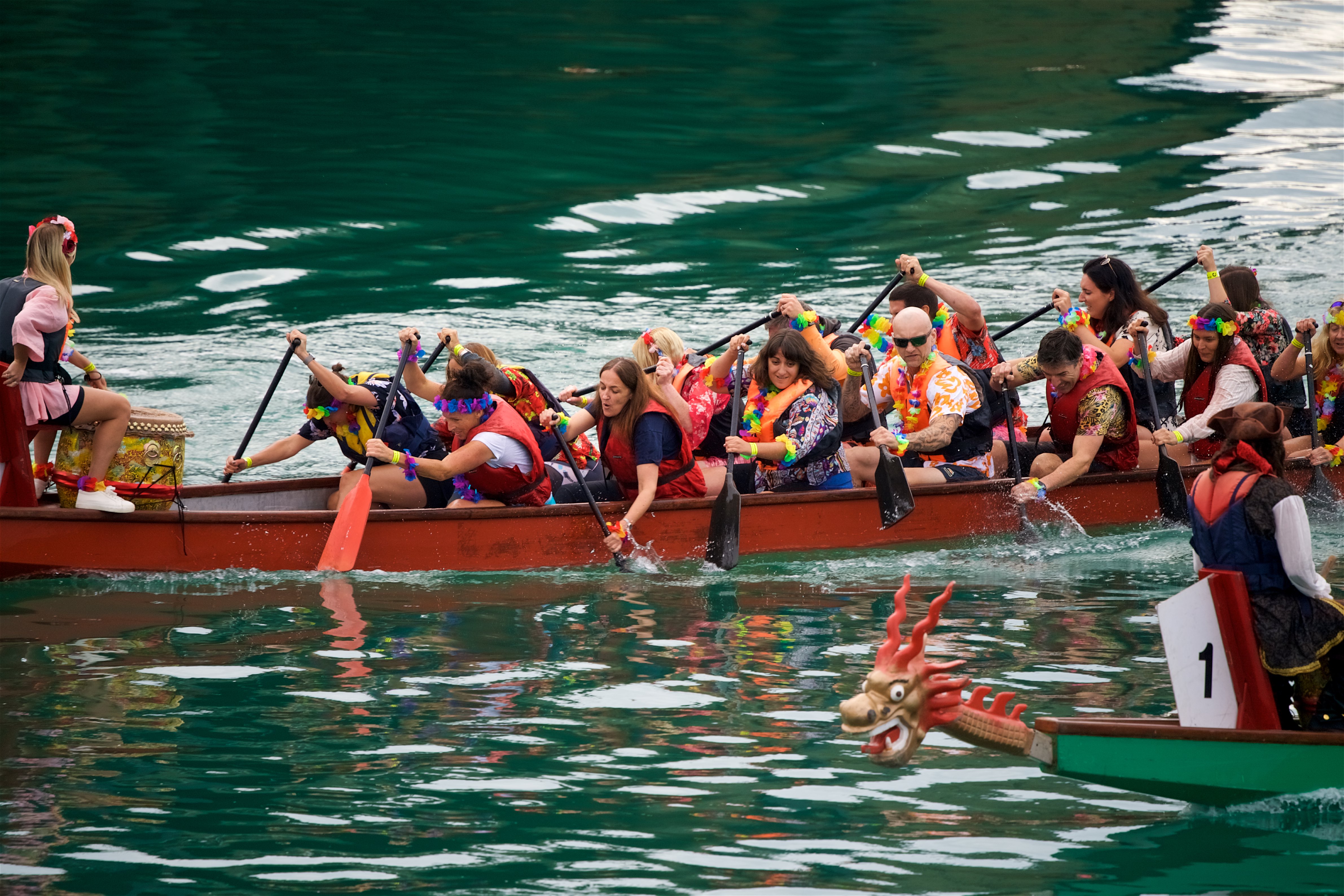 Image of two dragon boats racing