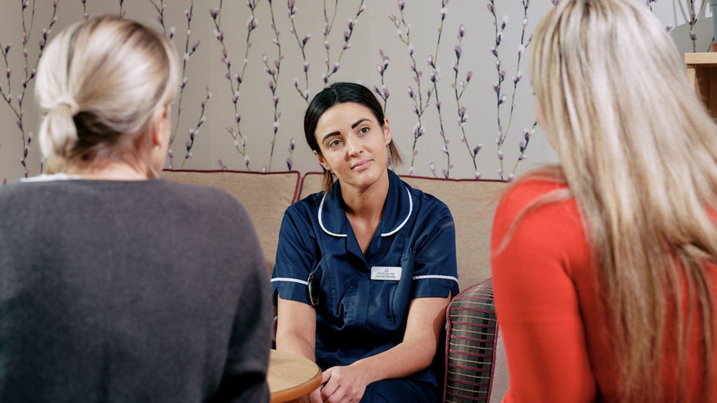 Nurse talking to family