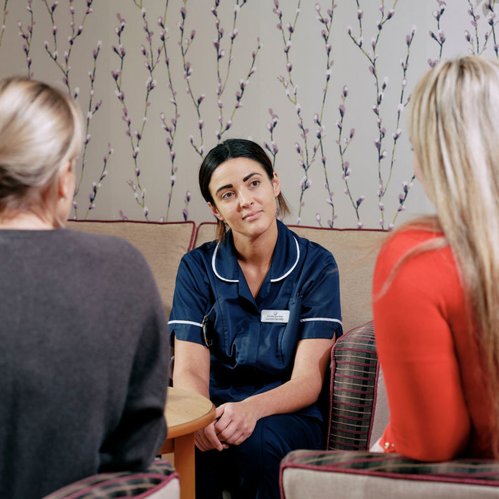 Nurse talking to family